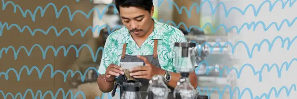 Restaurant Productivity: A barista in a floral shirt and apron is diligently preparing coffee at a counter, surrounded by coffee brewing equipment. The scene highlights the importance of using the right technology, such as POS systems, online ordering, kitchen displays, and digital menus, to enhance efficiency and productivity in a restaurant setting. Background patterns in light brown and blue add a modern, dynamic touch, symbolizing the integration of innovative technology in the food service industry.