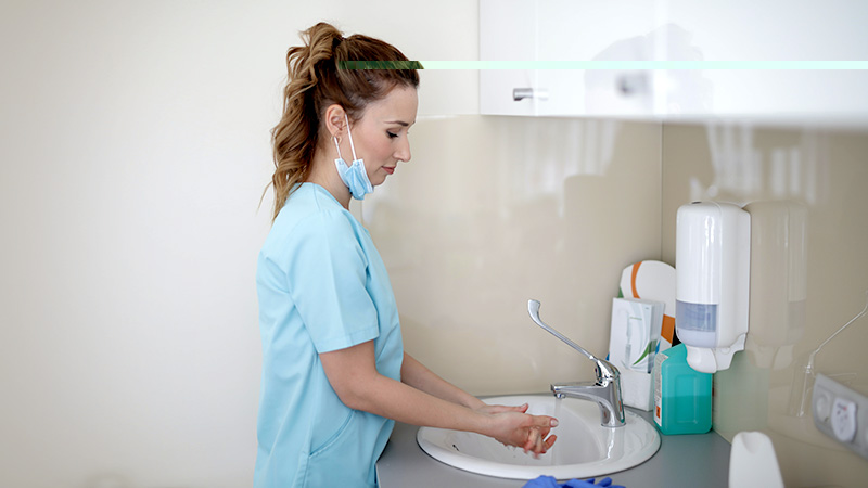 Nurse washing her hands