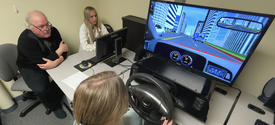 Photo of Mark Fillmore Working with Students in the Computer Lab