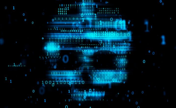 Lines of binary in the shape of a blue skull on a dark background