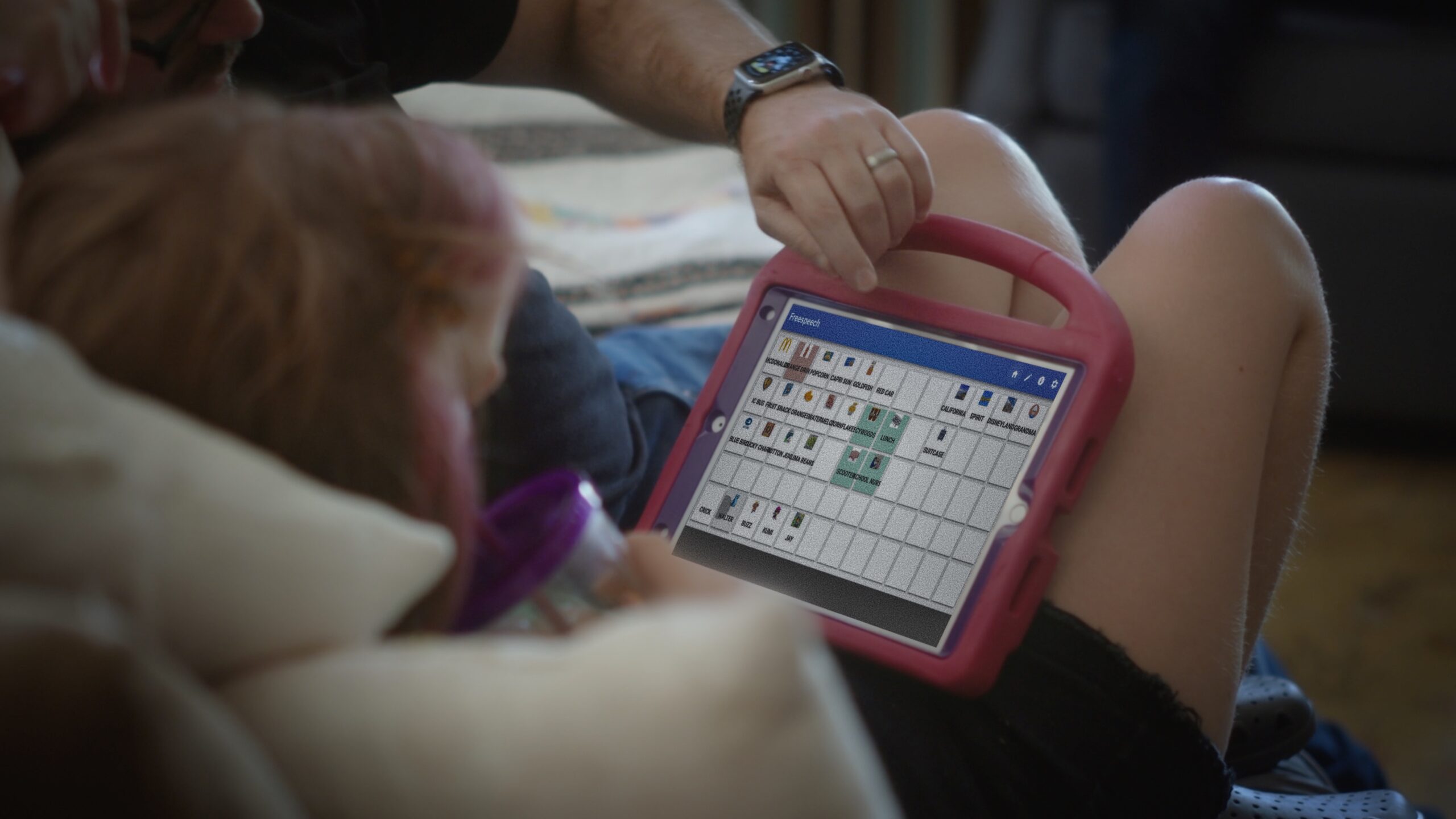 A person holding a tablet.