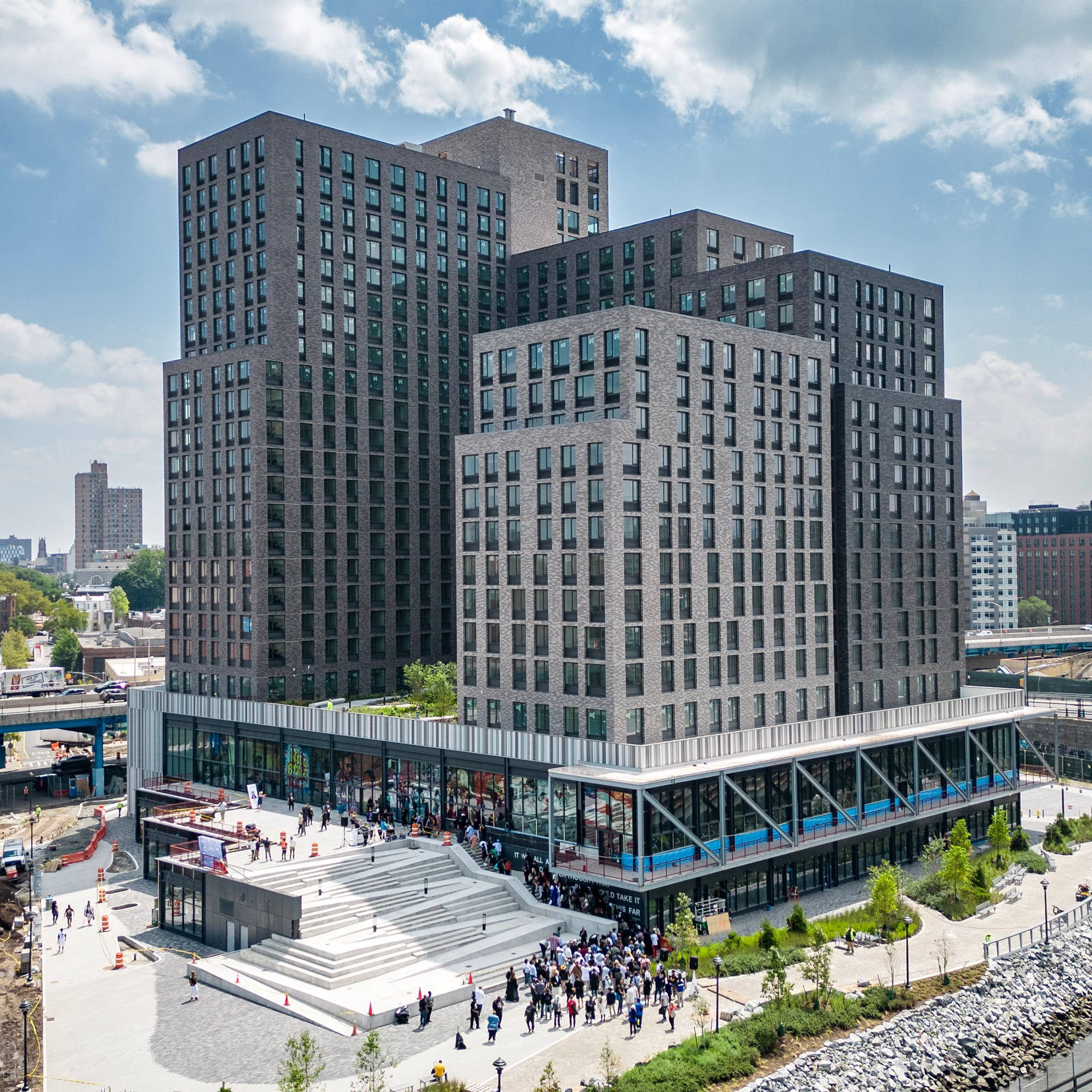 A large building with people walking around it.