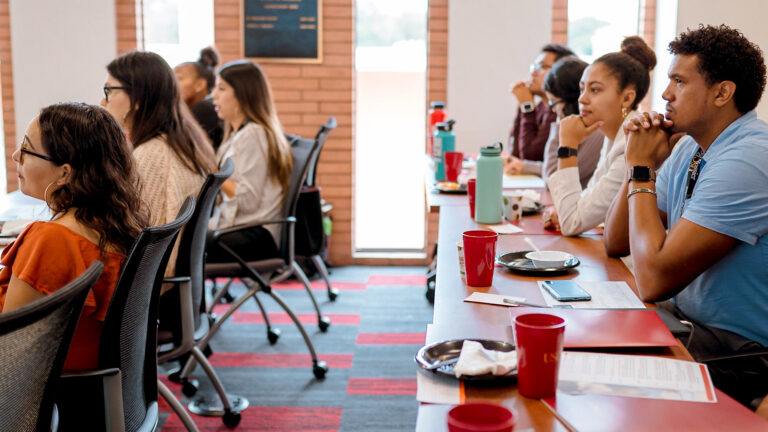 USC students in class, listening attentively.