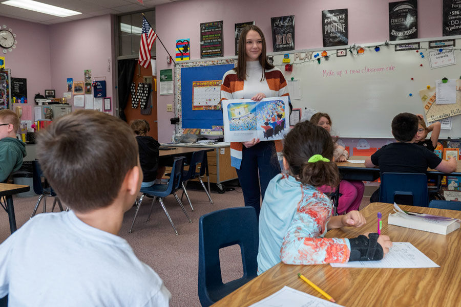 Student teaching a class at a local school