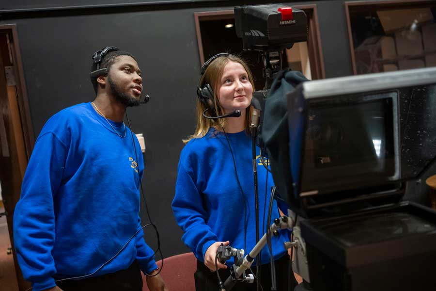 Students behind a television camera