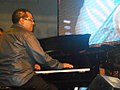 Danilo Pérez plays the piano with Tito Puente Jr. and the Panama Jazz Festival Ensemble, at the free concert in Plaza Catedral, San Felipe, Panama City, Panama.