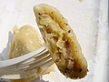 Dumplings (Polish pierogi, Ukrainian varenyky) stuffed with sauerkraut