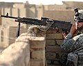 A 4th Infantry Division soldier manning an M240 machine gun in Iraq.