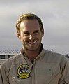 Josh Lucas poses near an F/A-18F Super Hornet after arriving on board Naval Air Station North Island July 17, 2005 (cropped)