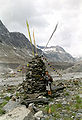 Big cairn in the Lauteraargletscher valley, Bern canton, Switzerland. The flags were placed there by buddhist monks.