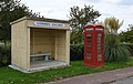 Commes - Escures bus stop in the French department of Calvados, in Normandy, with next to an old British telephone booth.