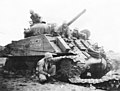 Sherman tank disabled by a land mine at Iwo Jima.