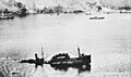 A Japanese transport ship sinks in Simpson Harbor at Rabaul due to Allied air attacks on November 2, 1943.