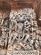 12th-century stone carving showing Vishnu avatar Varaha with Bhudevi legend at Shaivism Hindu temple Hoysaleswara arts Halebidu Karnataka India.jpg