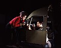 Riveting team working on the cockpit shell of a C-47 bomber