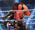 English: Lesnar preparing for the third and final F-5 to end Undertaker's undefeated streak, WrestleMania XXX.