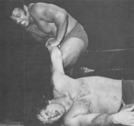 Rocky Johnson armlock Terry Funk.png