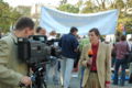 A correspondent of the ZDF station in Poland, in front of a demonstration held next to the Polish Sejm