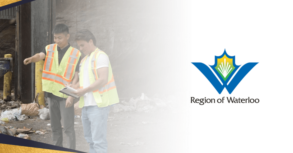 Two workers in safety vests looking at a waste management site next to the Region of Waterloo logo