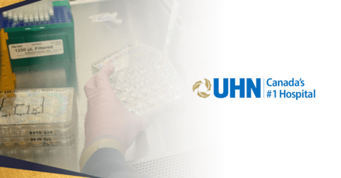 Hand wearing a glove holding a lab sample tester case next to the UHN logo