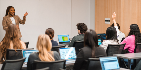 Employer hosting an EIS, gesturing for student to ask their question