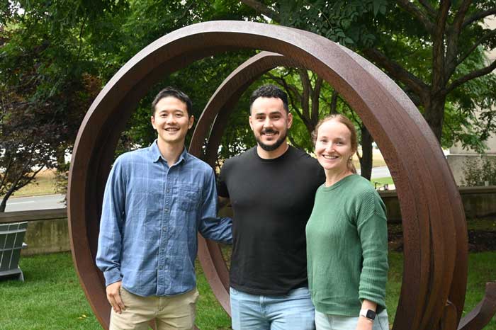 Left to right: MITEC's co-presidents Thomas Lee, Laurențiu Anton, and Rosie Keller outside