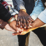 Community Stacking Hands to show teamwork