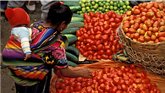 Woman with child at food market