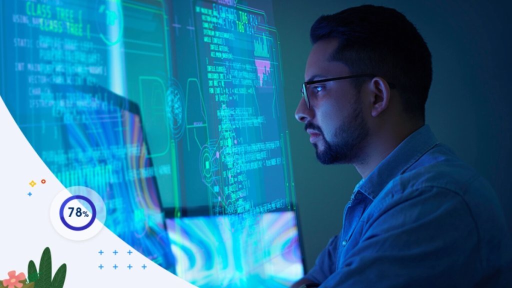 A man looks at text and graphs on a large glowing digital screen.