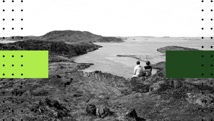 A stylized image of two people sitting on an oceanside cliff