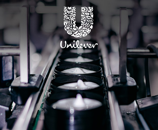 The Unilever logo is shown next to a factory line moving creams