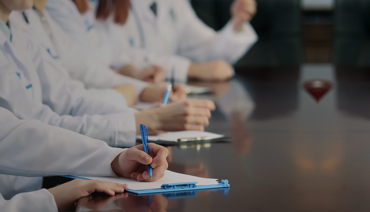 doctors are taking notes on their notepad