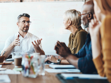 view of colleagues having a discussion during meeting