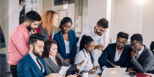 A group of people looking at the computer