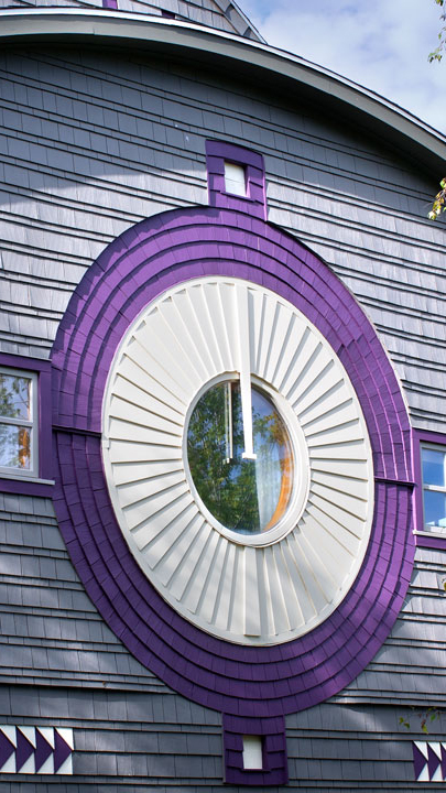 The side of a building with native American Indian inspired design elements.