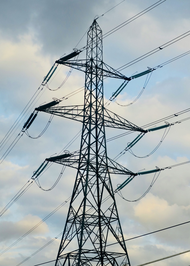 L2 suspension tower, part of an electrical transmission system, featuring cables suspended between tall pylons.