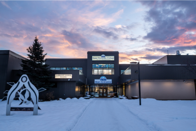 winter at KPC campus, showing the entrance at dusk