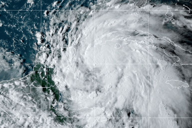 This satellite image taken at 6:10pm ET shows Tropical Storm Helene off the Gulf Coast of Florida near Mexico and Cuba on Tuesday, Sept. 24, 2024. [NOAA via AP]