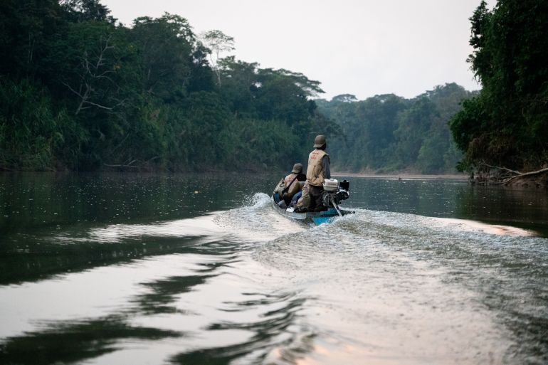 Huni Kuin protection agents Fredy Capitan and Nolasco Torres monitor a remote river for signs of isolated tribes in Peru’s Amazon [Neil Giardino/Al Jazeera]