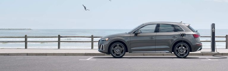 Three-quarter side view of an Audi A6 Sedan in motion. 