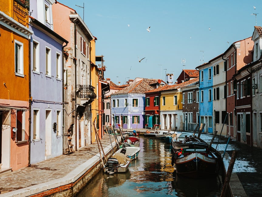 image of a canal lined with buildings before applying BeFunky's Watercolor DLX effect