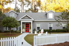 gray house with bright red door