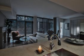 dark living room with candle on counter