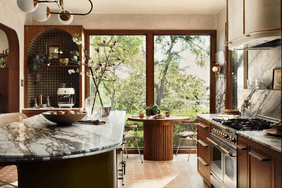 fixer upper: lakehouse kitchen with marble countertop, green tile arched nook