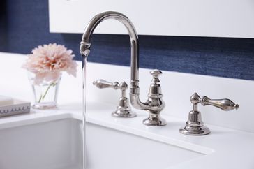 close up of water running in sink