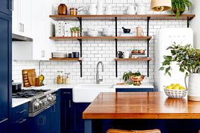 Kitchen with dark blue cabinets and wooden countertops