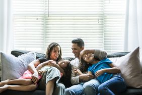 happy family on sofa at home