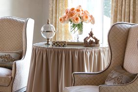 skirted table in beige living room