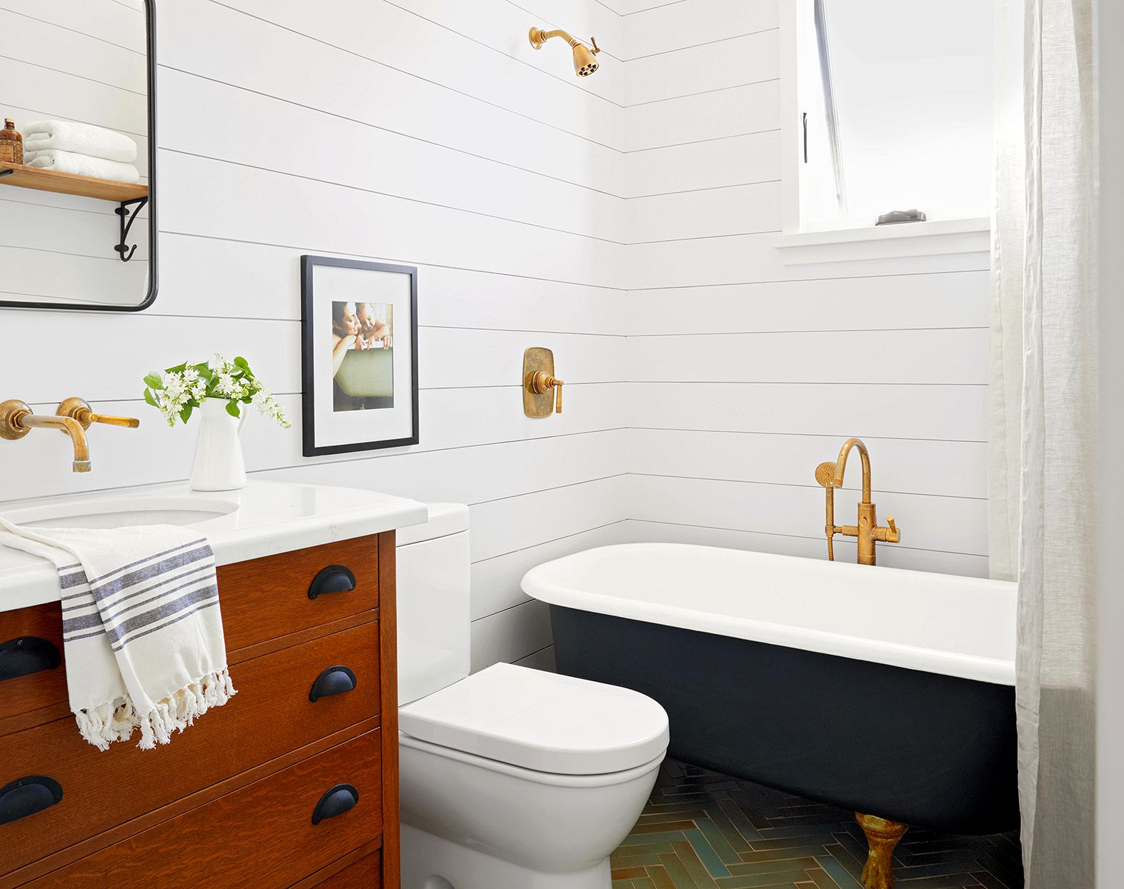 neutral bathroom with clawfoot tub and shiplap walls