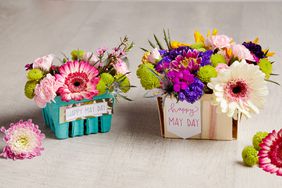 flowers bouquet in berry baskets for may day